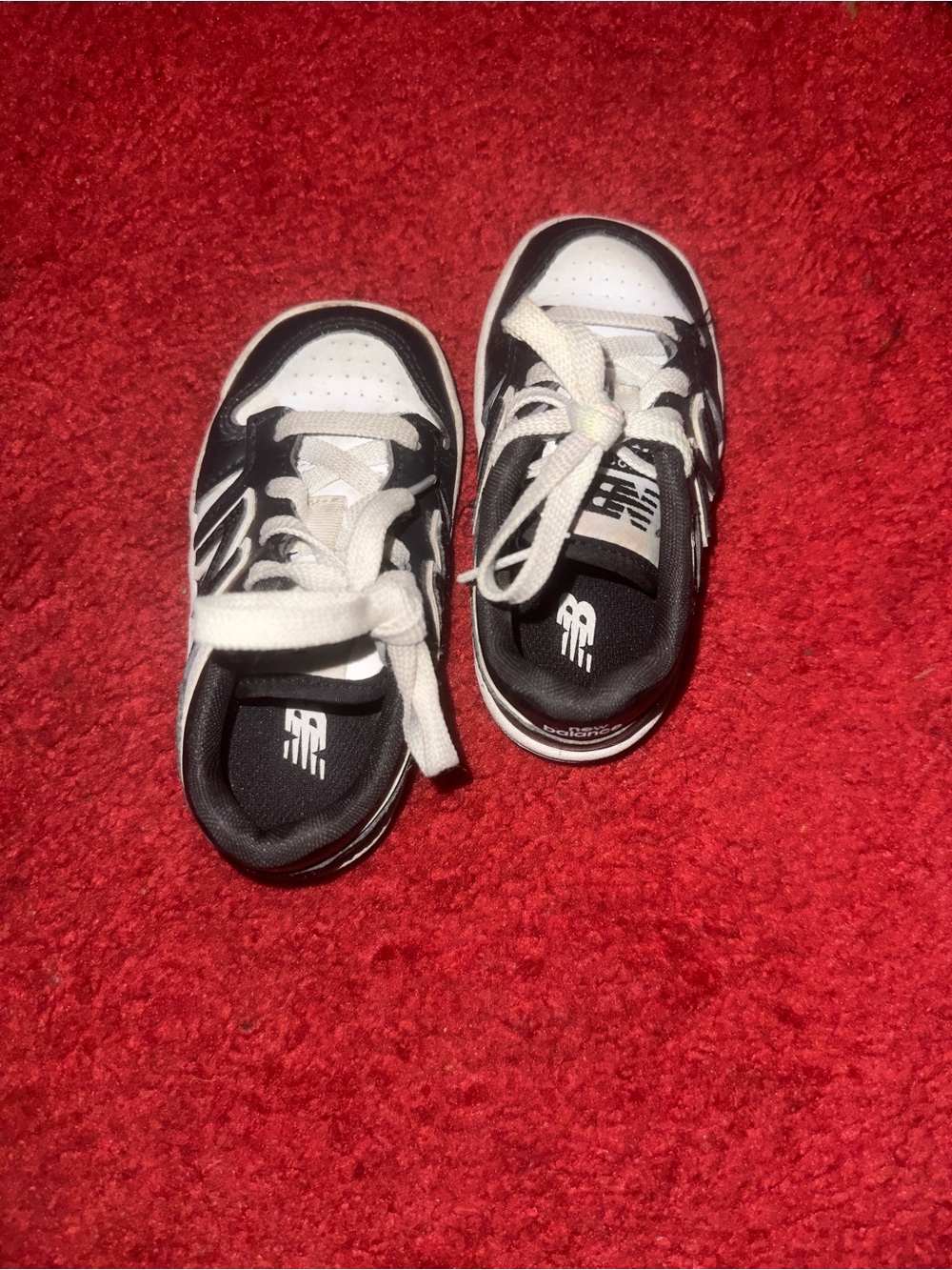 New Balance Kids Black and White Lace-Up Sneakers